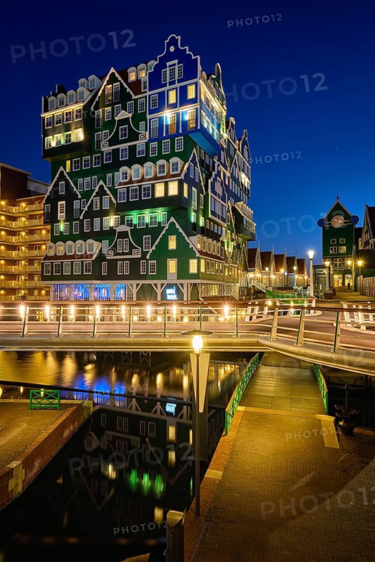 ZAANDAM, NETHERLANDS, MAY 8, 2017: Inntel Hotel in Zaandam illuminated at night. Design of 12-storey tall building opened in 2009 is the result of stacking a series of traditional Dutch houses