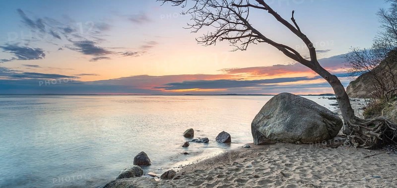 Beach with large boulders on the Bay of Greifswald at dusk after sunset, Mönchgut Nature Reserve, Groß Zicker, Mönchgut Peninsula, Rügen Island, Mecklenburg-Western Pomerania, Germany
