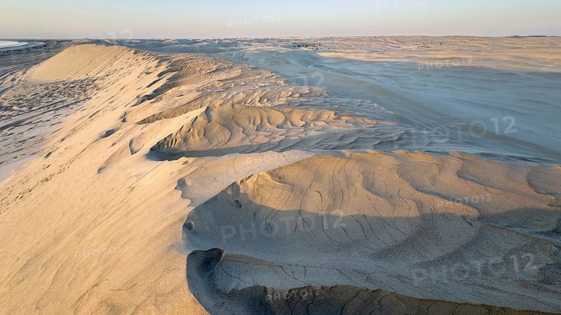 White sand dunes in the Khaluf Desert, Oman