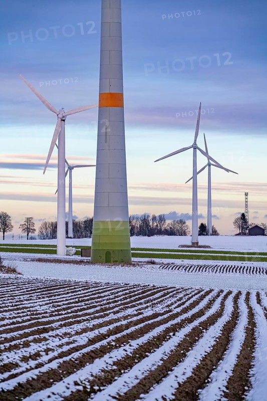 Wind farm, north of Lichtenau, self-proclaimed energy town, over 190 wind turbines and over 1200 solar panels generate 10 times as much electricity as the community of 11, 900 inhabitants consumes, largest onshore cluster of wind turbines in Germany, winter, slightly snow-covered landscape, North Rhine-Westphalia, Germany