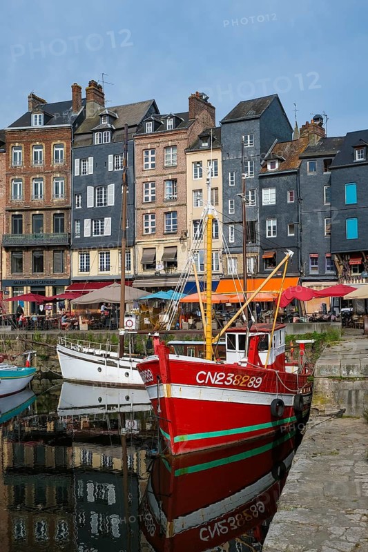 Honfleur, Normandy, France - Boats on the Quai Sainte-Catherine in the old harbour, Vieux Bassin, in the picturesque harbour town of Honfleur at the mouth of the Seine