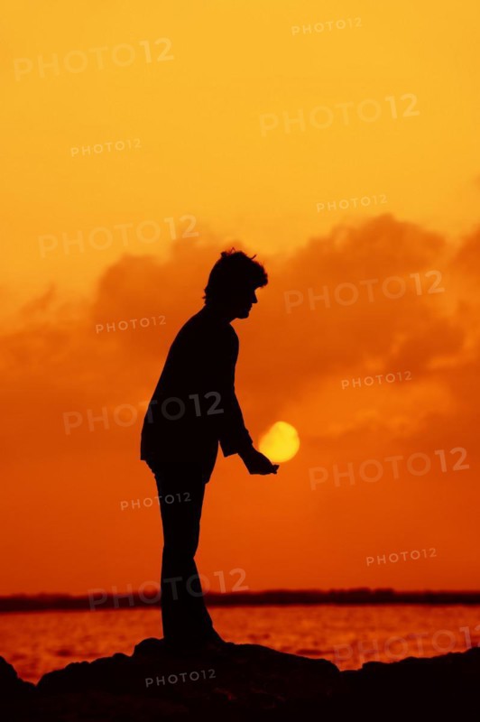 Woman at sunset on the coast, Camargue, Provence, South of France