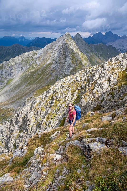 Hiker on the Carnic High Trail, ascent to the Raudenspitze, Carnic Main Ridge, Carnic Alps, Carinthia, Austria