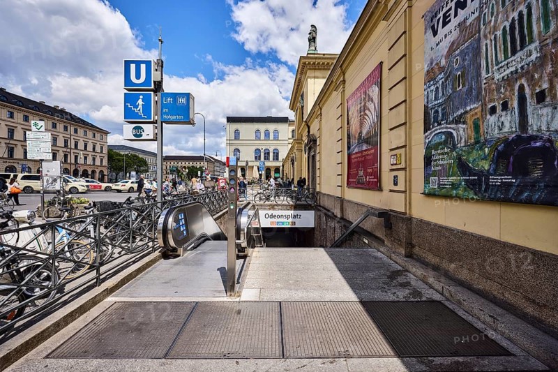 Subway stop, Odeonsplatz stop, lines U3, U6, U4 and U5, public transport, stairs, escalator, general architecture, wall, advertising poster, bicycles, image processing contrasts, blue sky, cumulus clouds, Residenzstraße, Odeonsplatz, Munich, state capital, district-free city, Bavaria, Germany
