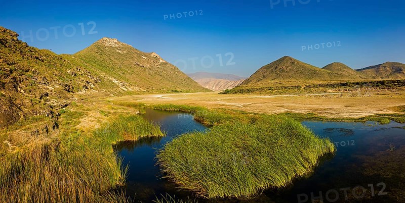 Landscape in Oman, mountains, Wadi Ashawq, road, reeds, waters Salalah, Al Mughsyal / Wadi Ashawq, Dhofar, Oman