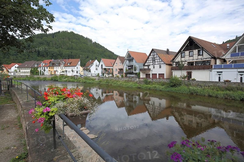 Houses with reflections on the banks of the Kinzig, Kinzigtal, Wolfach, Ortenau, Southern Black Forest, Black Forest, Baden-Württemberg, Germany