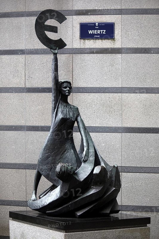 The bronze statue entitled Europe by May Claerhout holds up the euro symbol, Rue Wiertz, European Parliament, Brussels