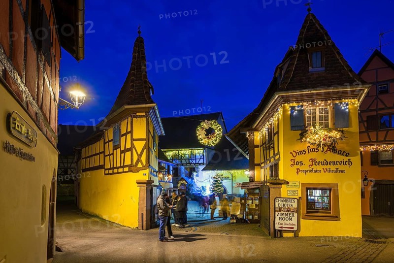 Houses illuminated and decorated for Christmas, Christmas market, blue hour, Eguisheim, Haut-Rhin department, Grand Est region, Alsace, France