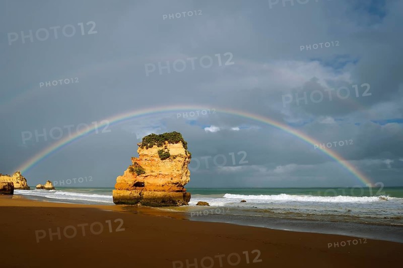 Rocks on beach with rainbow, Praia Dona Ana, Lagos, Algarve, Portugal