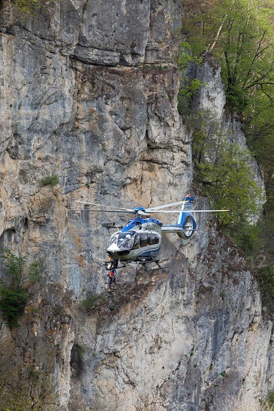 Police rescue operation. Helicopter in action at the slide rock near Bad Urach, Reutlingen district, Swabian Alb on 23/04/2025