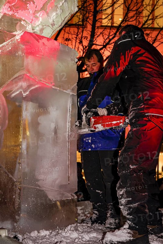 An ice sculpture is being created: ice carving street action as part of the long shopping night in the city center of Reutlingen, Baden-Württemberg, Germany, for editorial use only