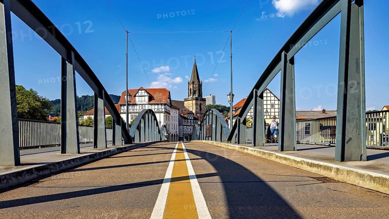 Bridge leads into the town centre with half-timbered houses and church, blue sky, The town of Rotenburg an der Fulda