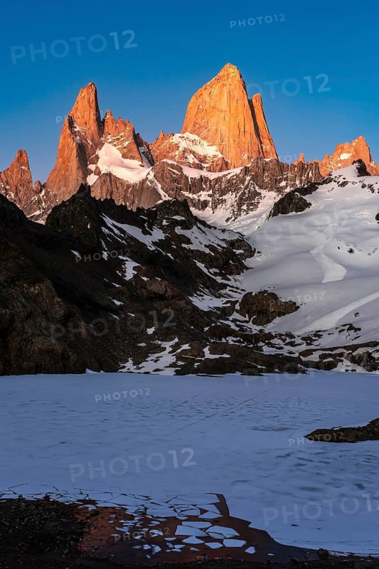 Mount Fitz Roy (Cerro Chaltén) in the alpenglow at sunrise, frozen Laguna de los Tres with ice floes in the foreground, Los Glaciares National Park, El Chaltén, Patagonia, Argentina