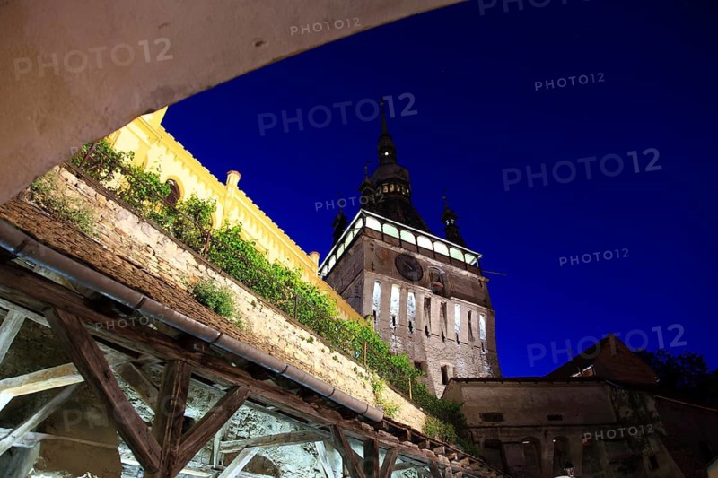Romania, hour tower at the blue hour in the historic old town of Sighisoara, German Sighisoara, town in Mures district in Transylvania, UNESCO World Heritage Site