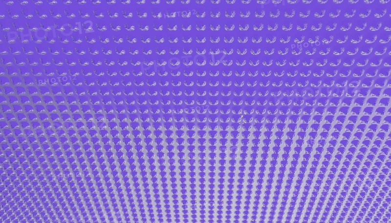 An abstract illustration featuring a geometric pattern of repeating dots, creating a 3D effect The vibrant purple gradient offers a visually striking and modern look