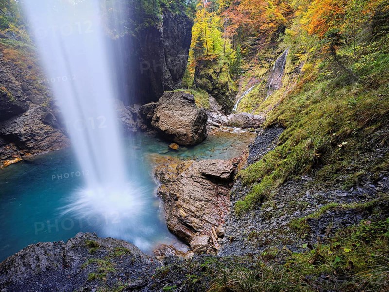 Waterfall mountain list in autumn-colored surroundings, Linthal, Klausenpass, Canton of Glarus, Switzerland
