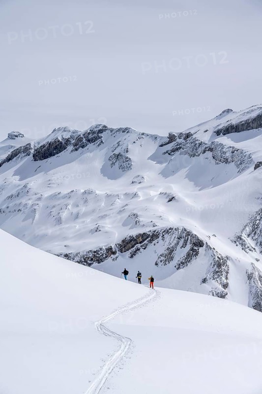 Three lonely ski tourers, winter in the Bernese Alps, Bernese Oberland, Switzerland