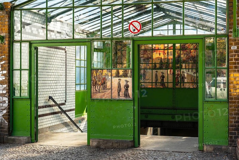 Historic side entrance with glass roof and wooden doors at Lichterfelde West S-Bahn station, Berlin, Germany
