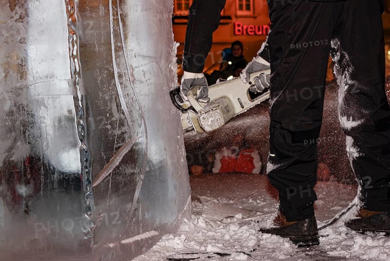 An ice sculpture is being created: ice carving street action as part of the long shopping night in the city center of Reutlingen, Baden-Württemberg, Germany, for editorial use only