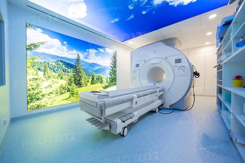 A modern MRI room with panoramic images and blue light that creates a relaxing atmosphere, radiology in the new health campus, Calw, Germany