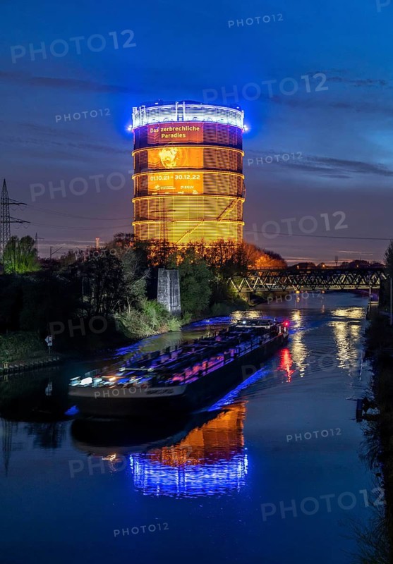 Neue Mitte Oberhausen, Gasometer exhibition hall, after renovation, Rhine-Herne Canal, evening lighting, canal boat, exhibition The Fragile Paradise, North Rhine-Westphalia, Germany