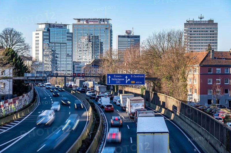 The A40 motorway, Ruhrschnellweg, in Essen, city skyline, Evonik office building, traffic jam in the westbound lane, Duisburg, slow traffic, North Rhine-Westphalia, Germany