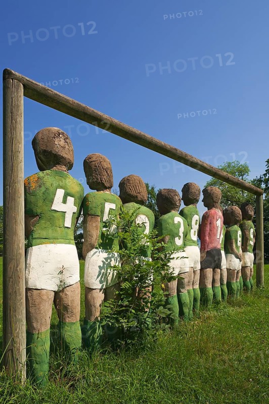 Sculptures of a football team, back view, by Günter Schumann, park of the Museum der Phantasie, Bernried am Starnberger See, Upper Bavaria, Bavaria, Germany