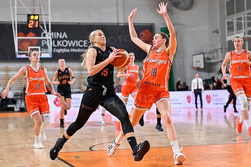 POLKOWICE, POLAND - FEBRUARY 22, 2023: Baskteball match EuroLeague Women between BC Polkowice vs Bourges Basket. In action Klaudia Gertchen (L) and Pauline Astier (R).