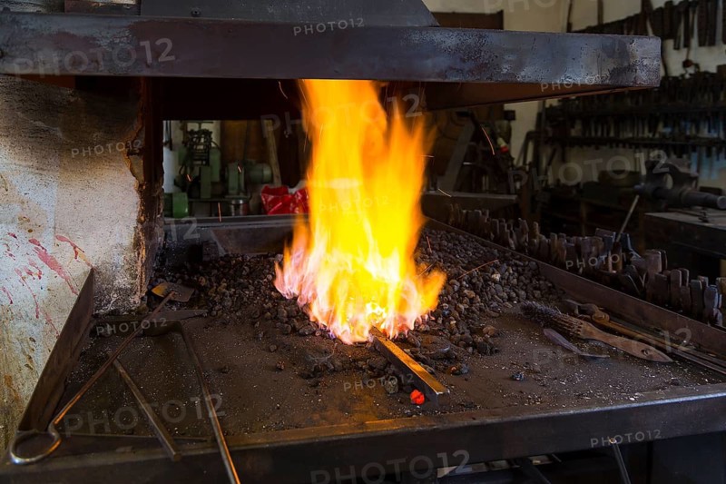A blacksmith forging, working at the Ehnert forge in Dresden-Bühlau, Saxony, Germany