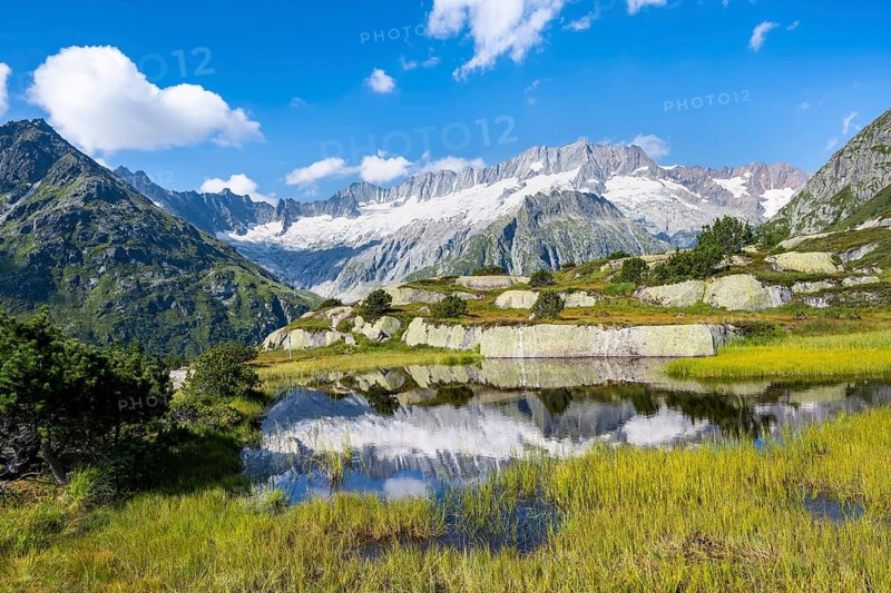 Picturesque mountain landscape, dammastock and damma glaciers reflected in Moorsee, Göscheneralp, Canton of Uri, Switzerland
