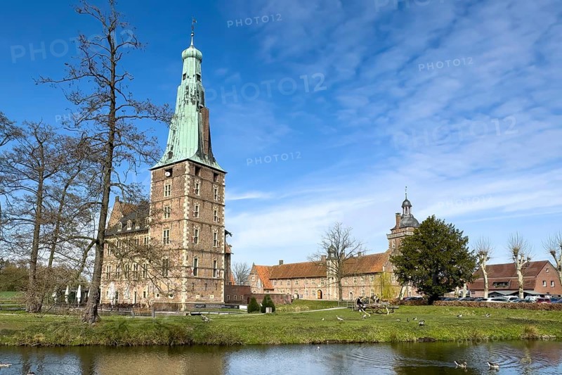 View over moat to historic moated castle from Renaissance Raesfeld Castle in spring, Freiheit Raesfeld, Münsterland, North Rhine-Westphalia, Germany