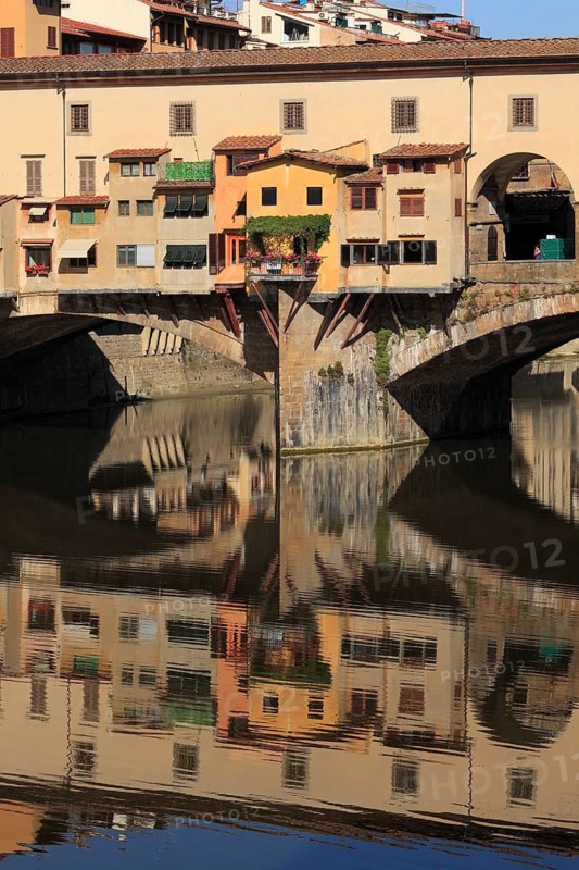 Ponte Vecchio and reflection in the river Arno, Florence, Tuscany, Italy