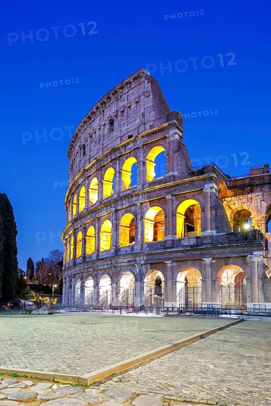Colosseum ancient amphitheatre at night in Rome, Italy