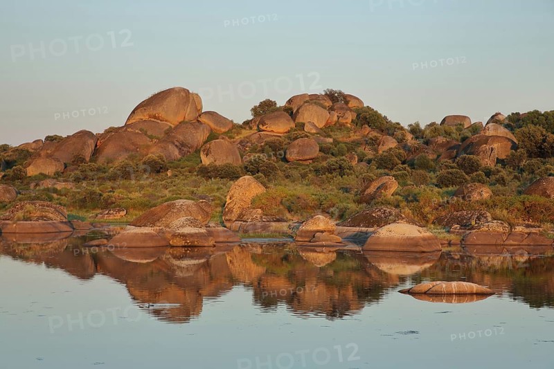 Reflection of rock formations in the lake with water, lull, rocky landscape, lakeside, lighting atmosphere, Los Barruecos, Malpartida de Caceres, Extremadura, Spain
