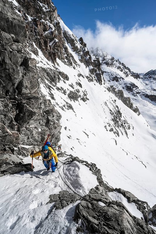 Climbers with skis ascending a steep snow slope to the Porta d'Es-cha saddle, Bündner Haute Route ski tour, Albula Alps, Rhaetian Alps, Grisons, Eastern Switzerland, Switzerland