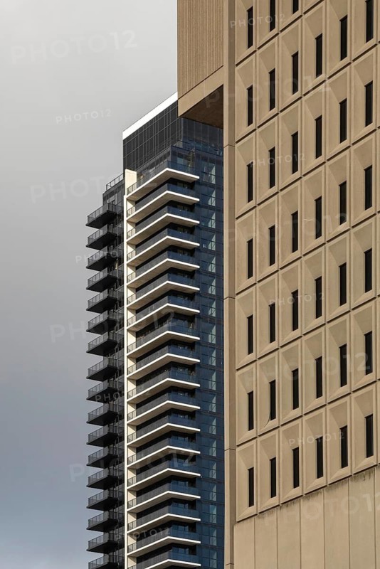 London, Ontario, Canada - The constrasting architecture of the Ontario Court of Justice and a modern luxury apartment building.