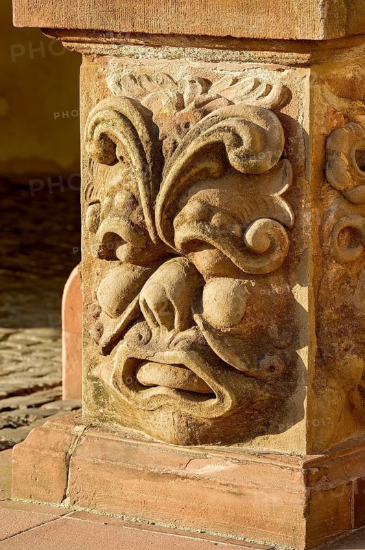 Baroque relief, grim, enemy-deterring face on column base, Upper Tor, Landgrave's Castle, Bad Homburg vor der Höhe, Hesse, Germany