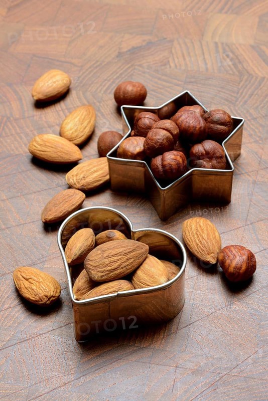Nuts and cookie cutters, almonds and hazelnuts