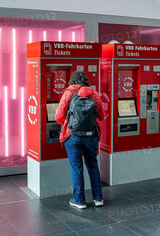 Everyday scenes, travelers and railway employees as well as the interior design, signs, signposts and the DB travel center, in and at Berlin Central Station, Germany