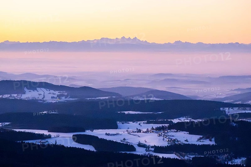 View from Mount Lusen over the hills of the bavarian forest at sunrise in winter, Bavaria, Germany