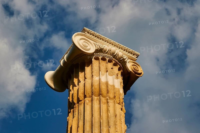 Pillar of Nike, close-up of a decorative ancient column against a cloudy sky, Archaeological Site, Ancient Olympia, Olympia, Peloponnese, Greece