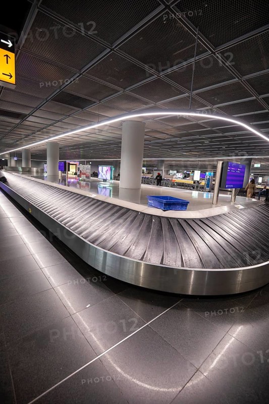 12.03.2026 empty baggage carousel due to Lufthansa strike and route closures, very few passengers at Frankfurt Airport, Hesse, Germany