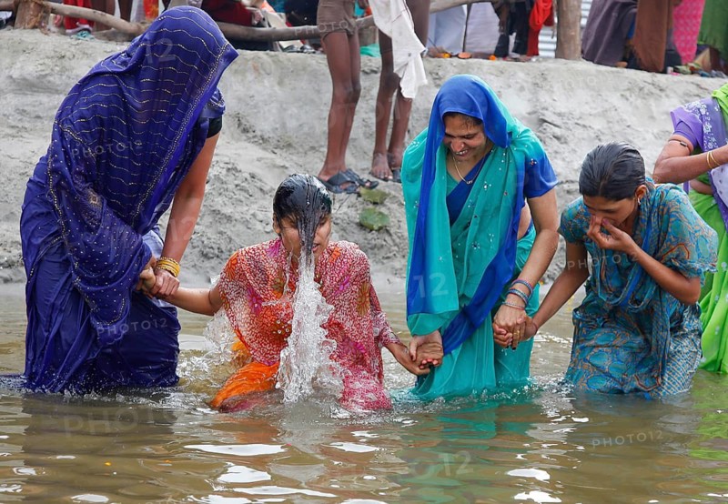 Allahabad, India, 20.01.10 - Hindus meet at Magh Mela in Allahabad to take a holy bath at the Sangam at the confluence of the Ganges, Yamuna and Saraswati rivers. Devotees take holy dip at Sangam. Magh Mela is an annual Hindu ritual hero on the banks of Sangam.The Mela is also known as the mini Kumbh Mela. It is held in the Hindu month of Magh