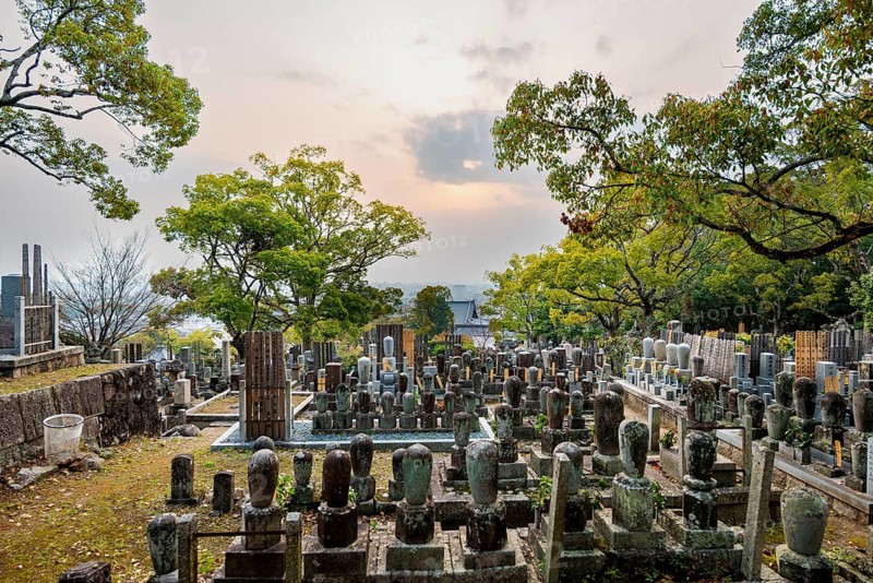 Tombstones at cemetery at sunset, Konkai-Komyoji Temple, Kurodanicho, Kyoto, Japan