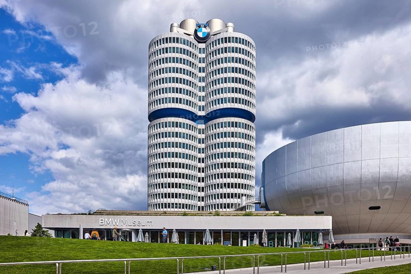 BMW museum, car museum, BMW corporate headquarters, high-rise building, modern architecture, commercial building, architect Karl Schwanzer, BMW four-cylinder, BMW tower, BMW high-rise building, sidewalk, metal railing, meadow, blue sky, white and dark gray cumulus clouds, Am Olympiapark, Munich, state capital, district-free city, Bavaria, Germany