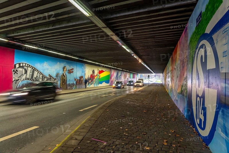 Huge street art pictures in a road tunnel in Gelsenkirchen, the approximately 120 meter long railway underpass of Wickingstraße was extensively painted and sprayed on both sides by 11 Gelsenkirchen graffiti artists and collectives, over a total length of 174 meters, the wall paintings showed motifs from Gelsenkirchen history, from economy, coal, steel, soccer, Schalke 04, culture, life, to the 150.year-old city Anniversary on 29.11.25, North Rhine-Westphalia, Germany