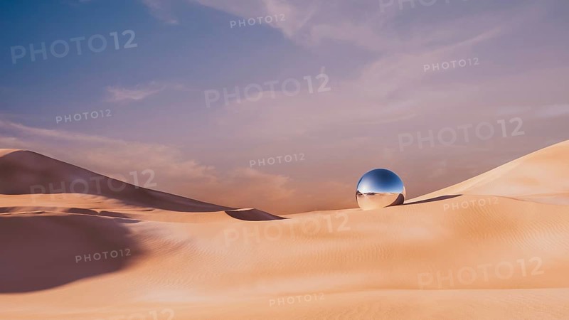 This surreal desert landscape showcases rolling dunes under a pastel sky, with a reflective metallic sphere resting prominently amidst the sand