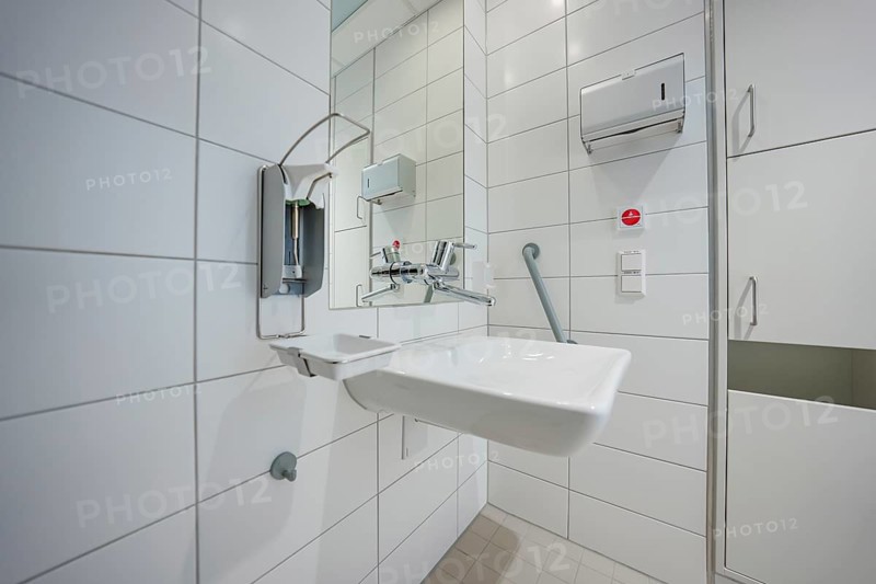 Sterile bathroom with modern sink and tiles in hospital environment, patient room cash desk in the new Calw hospital, Black Forest, Germany