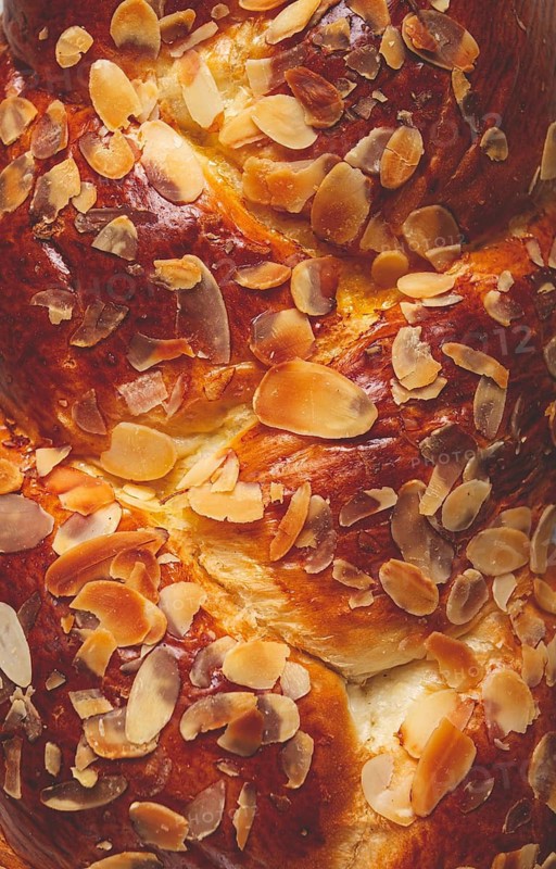 Braided, sweet bread pie, with sliced almonds, close-up, breakfast, braided bread, brioche, top view, no people