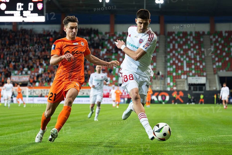 LUBIN, POLAND - MARCH 31, 2025: Football match between KGHM Zaglebie Lubin vs Rakow Czestochowa. Tomasz Pienko (L) Matej Rodin (88)
